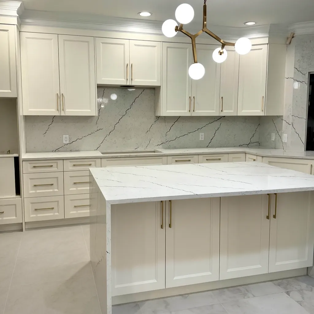 Bright custom kitchen with island by Juniper Cabinetry